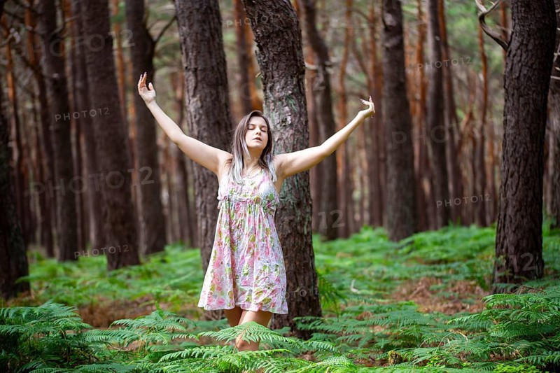 Young woman bathing in the forest (Shinrin Yoku), nature therapy from Japan