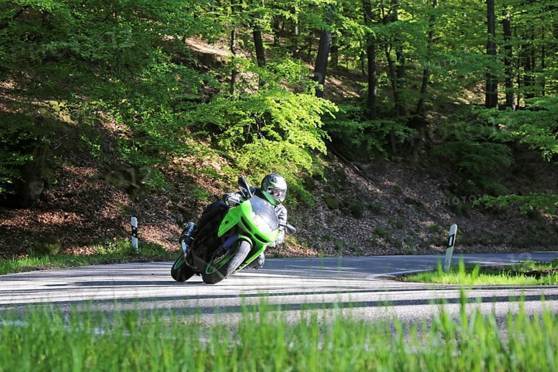 Sporty motorcyclist on a trip into the countryside (Edenkoben Valley, Palatinate Forest)