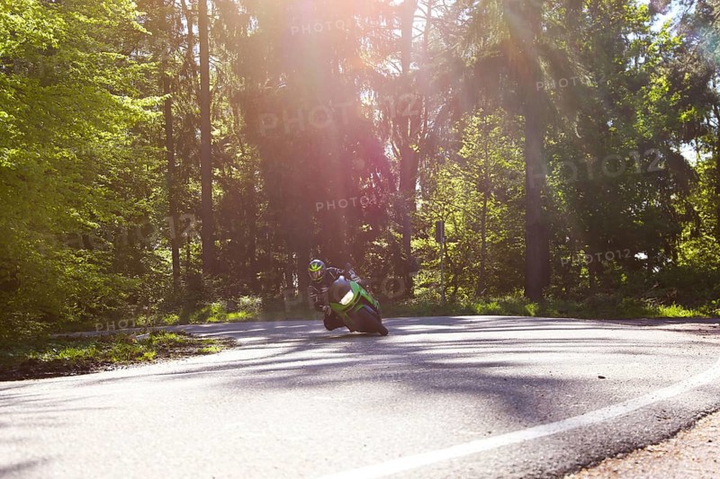 Sporty motorcyclist on a trip into the countryside (Edenkoben Valley, Palatinate Forest)