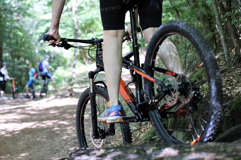 Close-up of a mountain biker in difficult terrain