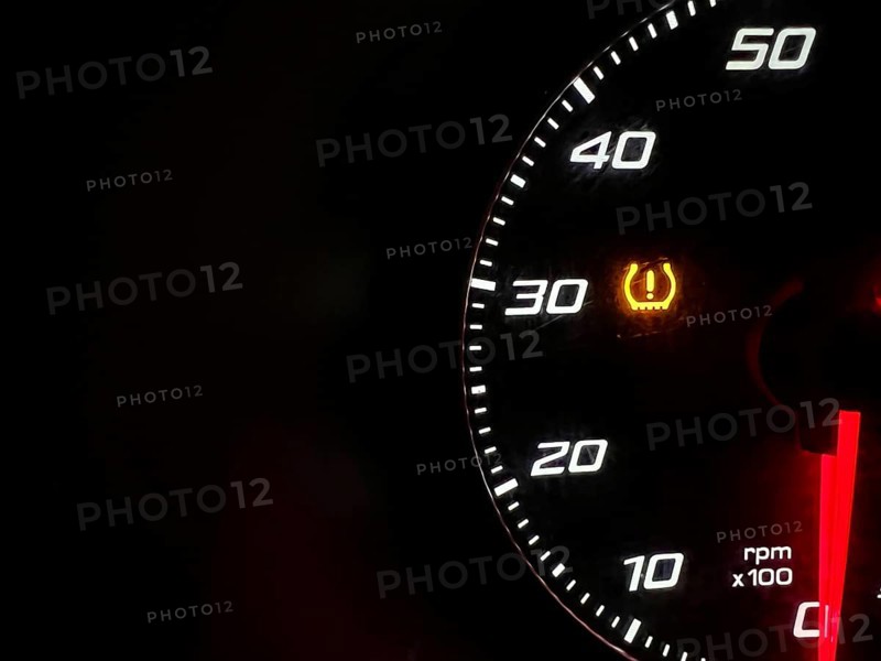 Car dashboard panel icon on a black background. Tire pressure monitoring