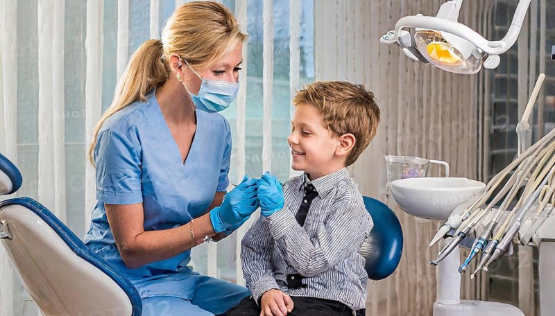 AI generated, dentist treats little boy, dentist, blonde, 30, 35, years, dental treatment, follow-up, AI generated
