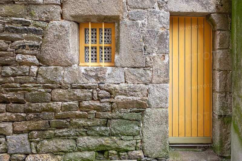 House facade with yellow door and yellow windows, Roscoff, Finistere, Brittany, France, Europe