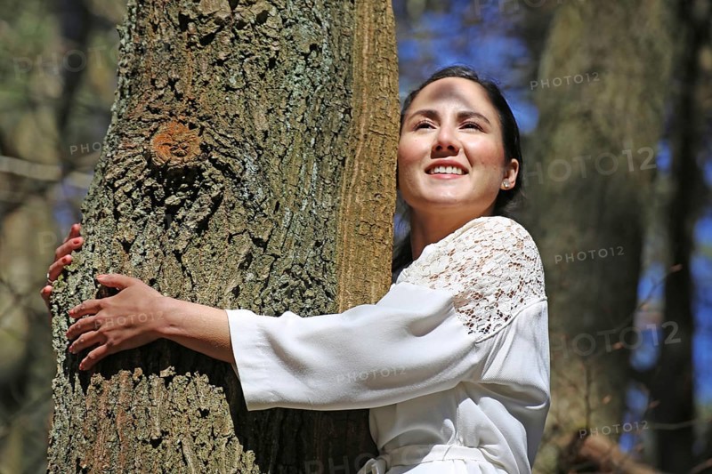 Young woman bathing in the forest (Shinrin Yoku), nature therapy from Japan