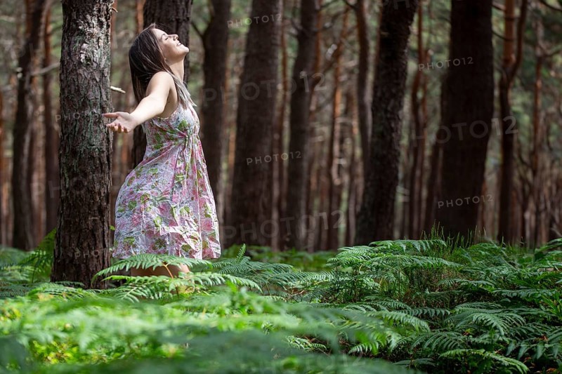 Young woman bathing in the forest (Shinrin Yoku), nature therapy from Japan