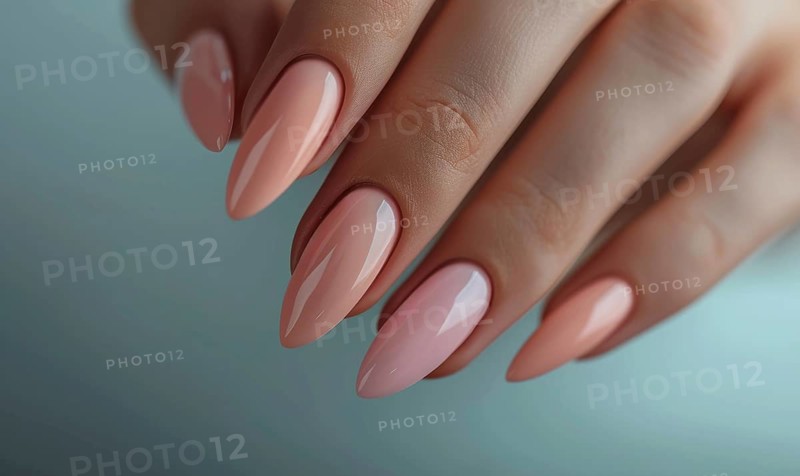 Female hands with pink and beige nail design. Nail polish manicure AI generated