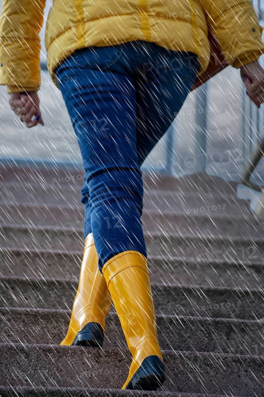 Woman with yellow wellies