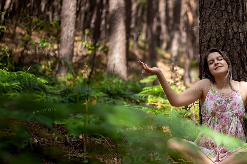 Young woman bathing in the forest (Shinrin Yoku), nature therapy from Japan