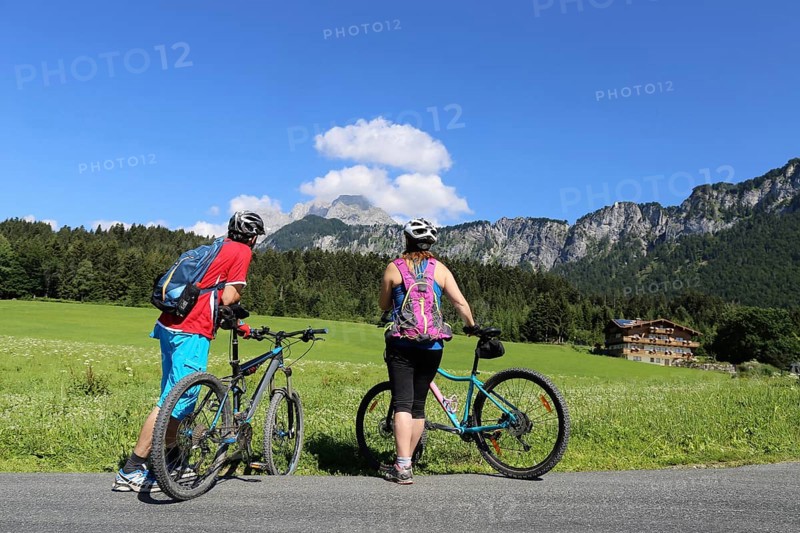 Mountain bikers enjoy the panorama from the Wilder Kaiser