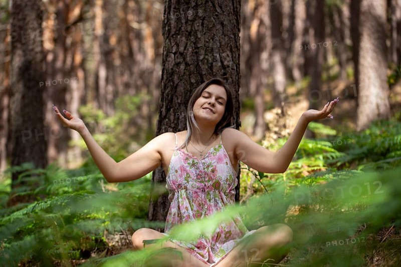 Young woman bathing in the forest (Shinrin Yoku), nature therapy from Japan