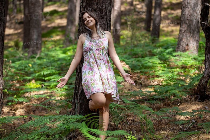 Young woman bathing in the forest (Shinrin Yoku), nature therapy from Japan