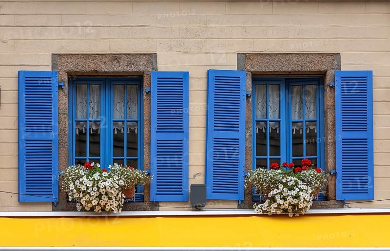 House facade with two windows, blue window frames and blue shutters, Roscoff, Bretagne, France, Europe