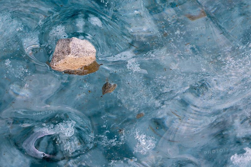 Trapped stone in an ice structure, glacier cave, winter, Morteratsch glacier, Pontresina, Engadine, Grisons, Switzerland, Europe