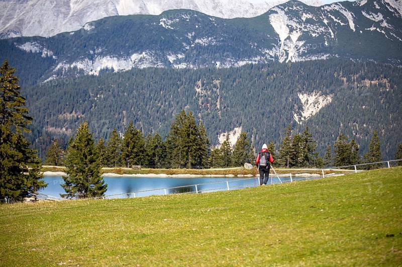 Woman hiking at the Kaltwassersee lake in Seefeld, Tyrol