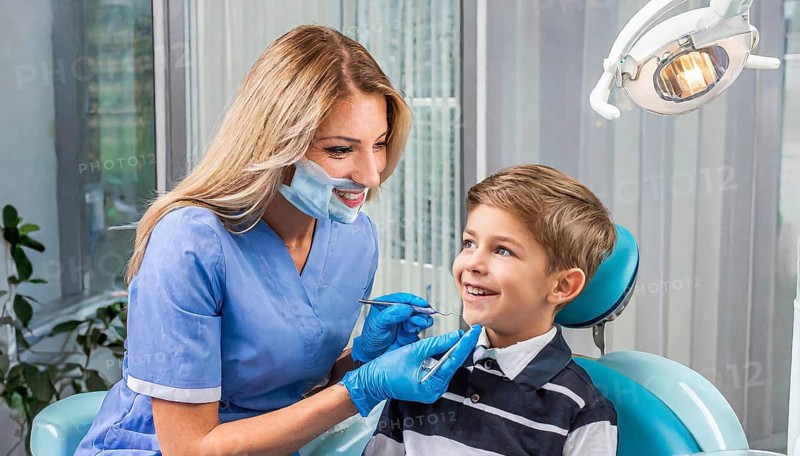 AI generated, dentist treats little boy, dentist, blonde, 30, 35, years, dental treatment, follow-up, AI generated