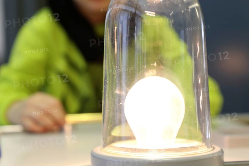 Child conducting a physics experiment with a simple circuit