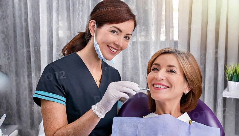 AI generated, dentist treats a middle-aged woman, dentist, blonde, 30, 35, years, dental treatment, follow-up, patient, AI generated