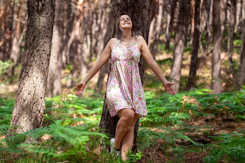 Young woman bathing in the forest (Shinrin Yoku), nature therapy from Japan