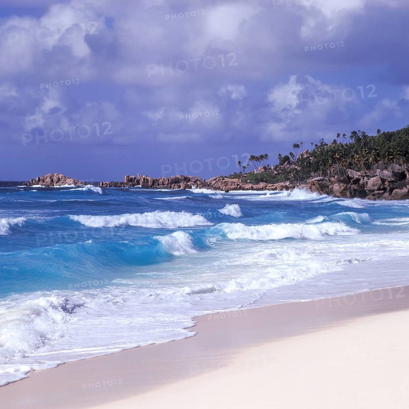 Waves in a storm on La Digue at Grand Anse beach, Seychelles, Africa
