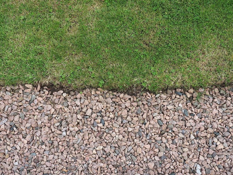 Green meadow and gravel background