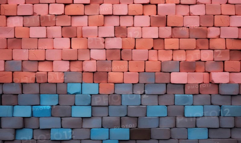 A wall with bricks transitioning in color from orange to blue, creating a gradient effect AI generated