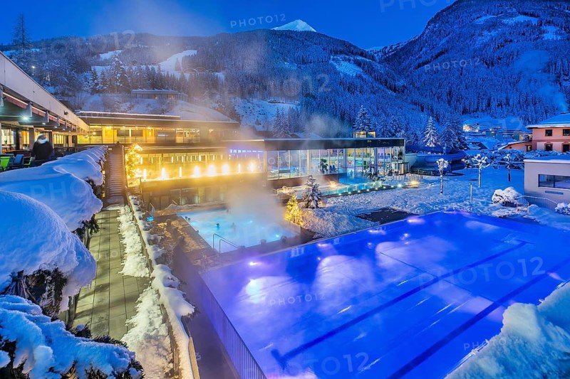 Snow-covered rock spa in winter, thermal bath at dusk, Bad Gastein, Gastein Valley, Hohe Tauern National Park, Salzburg Province, Austria, Europe