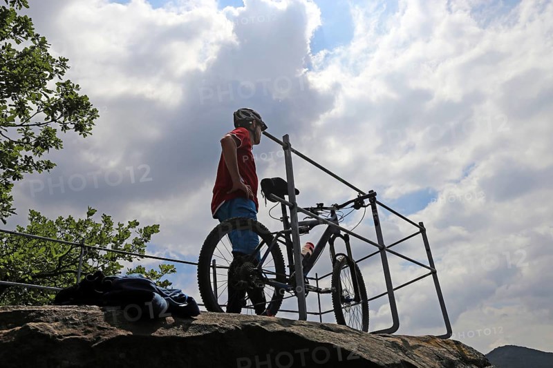 Mountain biker enjoys the view of the Palatinate Forest above Neustadt an der Weinstrasse