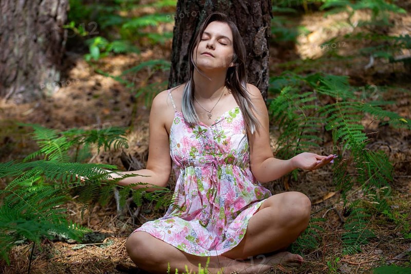 Young woman bathing in the forest (Shinrin Yoku), nature therapy from Japan