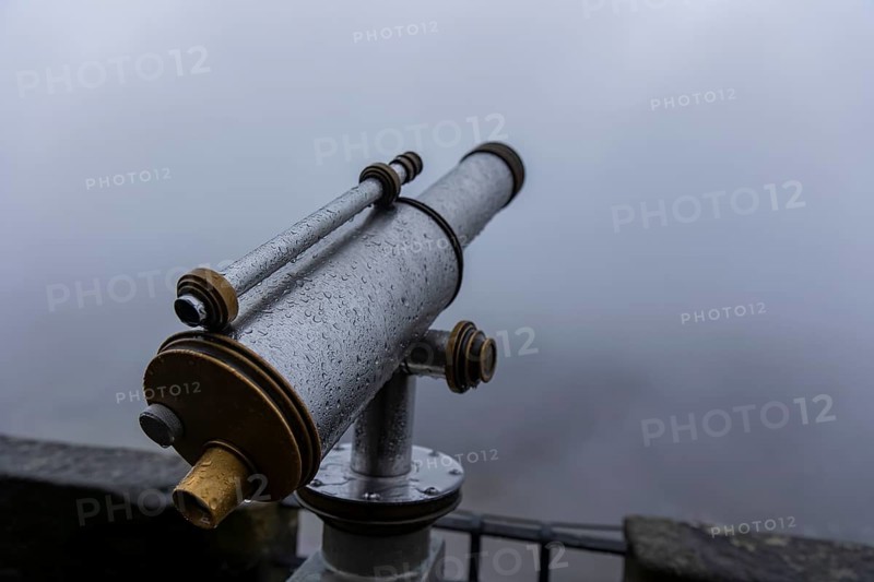 Winter atmosphere at the mountain fortress. Paying telescope with water drops, Koenigstein, Saxony, Germany, Europe