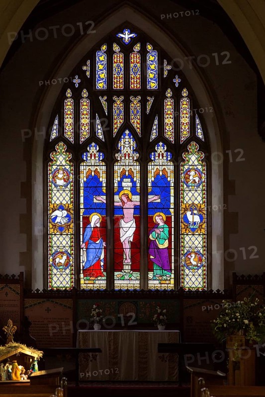 Stained glass east window in church of Saint Michael, Peasenhall, Suffolk, England, UK circa 1861 by Thomas Willement, Crucifixion of Jesus Christ