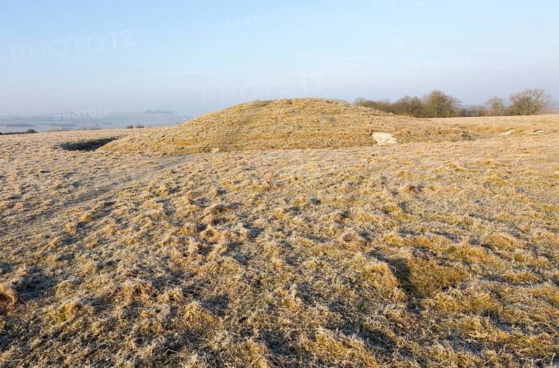 Bronze Age bowl barrow on Windmill Hill, a Neolithic causewayed enclosure, near Avebury, Wiltshire, England, UK
