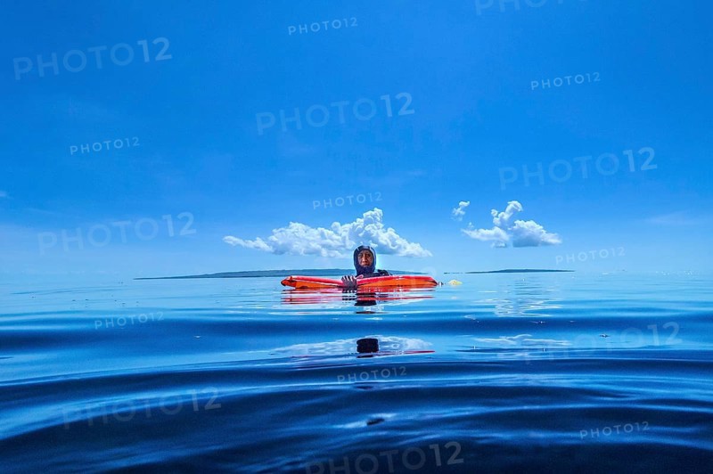 Dive guide with dive buoy, Wakatobi Dive Resort, Sulawesi, Indonesia, Asia