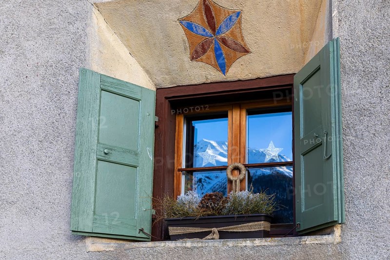Windows on historic house, sgraffito, facade decorations, shutters, Guarda, Engadin, Grisons, Switzerland, Europe