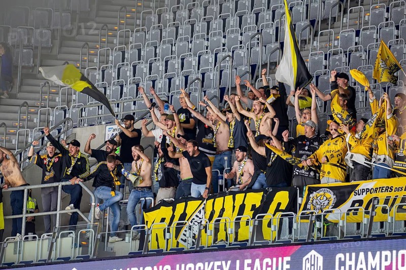 Ice hockey fans of the Rouen Dragons France celebrate a goal of their team in the SAP Arena