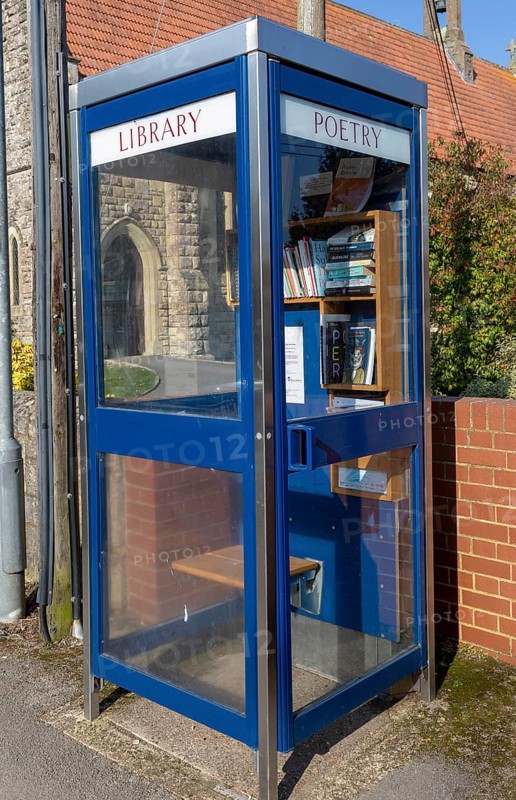 Old telephone booth box used as a poetry library, Tisbury, Wiltshire, England, UK