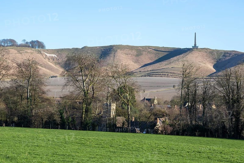 White horse, Lansdowne monument, Oldbury Camp hill fort, chalk scarp slope, Cherhill village, Wiltshire, England, UK