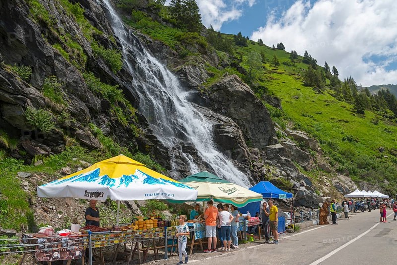 Lively atmosphere at a market stall near a large waterfall on a road, Capra Waterfall, Goat Waterfall, Transfogarasan High Road, Transfagarasan, TransfagaraÈ™an, FagaraÈ™ Mountains, Fagaras, Transylvania, Transylvania, Transylvania, Ardeal, Transilvania, Carpathians, Romania, Europe