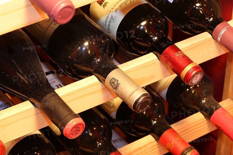Wine cellar with red wine bottles (editorial)