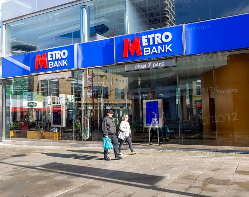 Signs on Metro Bank building, Regent Street, Swindon, Wiltshire, England, UK