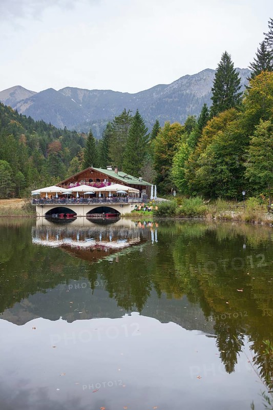 Pflegersee with inn under a cloudy sky, Garmisch-Partenkirchen, Werdenfelser Land, Upper Bavaria, Bavaria, Germany, Europe