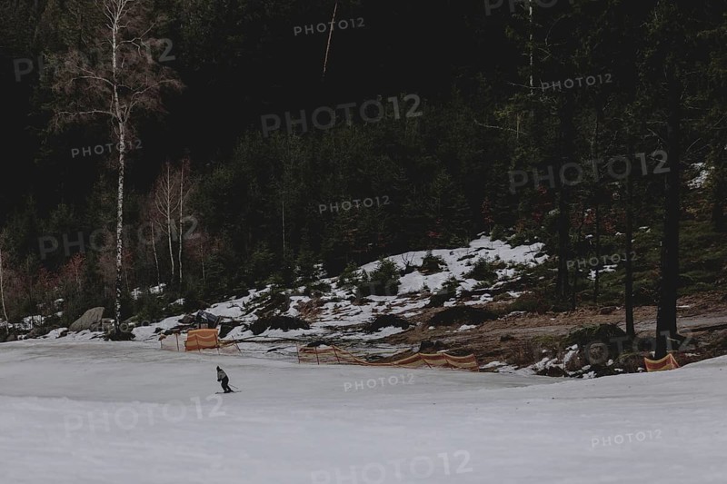 A skier skiing on a snow-covered slope, taken on a ski slope in the Jizera Mountains ski resort near Albrechtice v Jizerskych Horach, 05.02.2024. The Czech low mountain range with its ski resort is affected by increasingly warmer and shorter winters