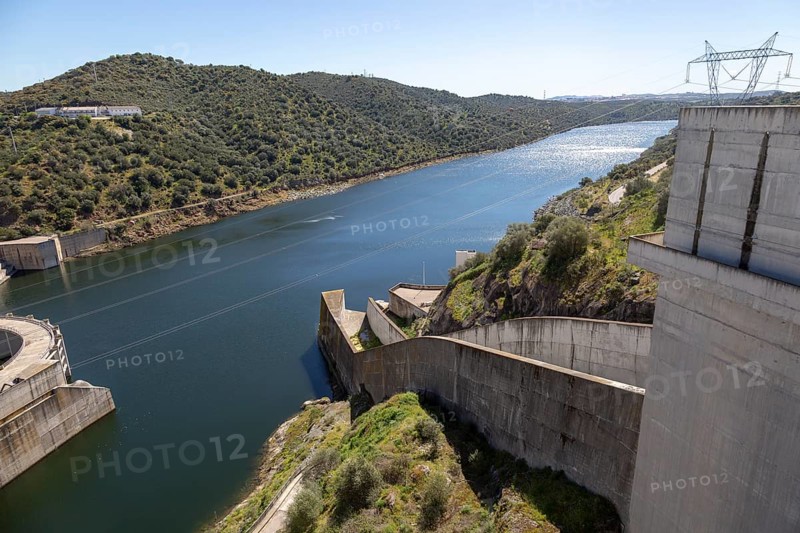 Barragem do Alqueva dam part of the multipurpose water management project on the Rio Guadiana river hydro-electricity generation electricity power lines