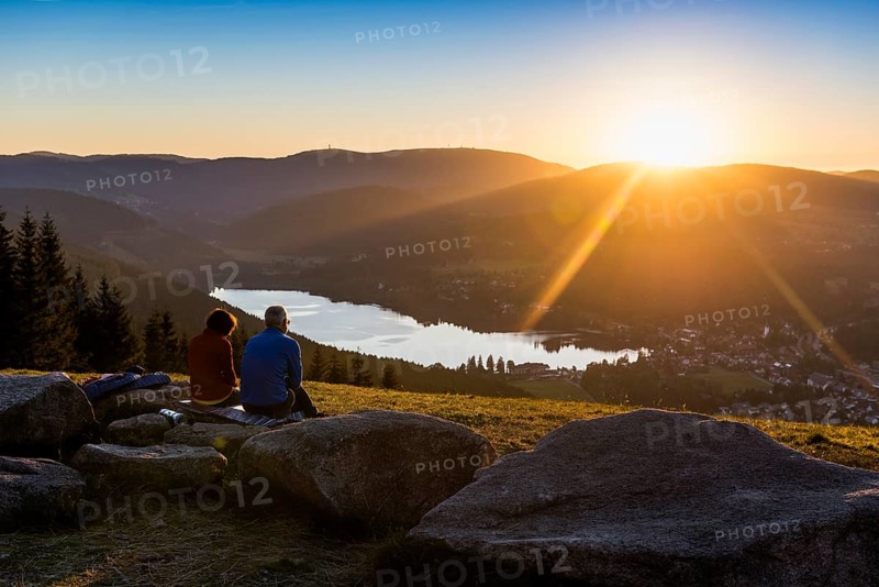 Elderly couple, view from Hochfirst to Titisee and Feldberg, sunset, near Neustadt, Black Forest, Baden-Wuerttemberg, Germany, Europe