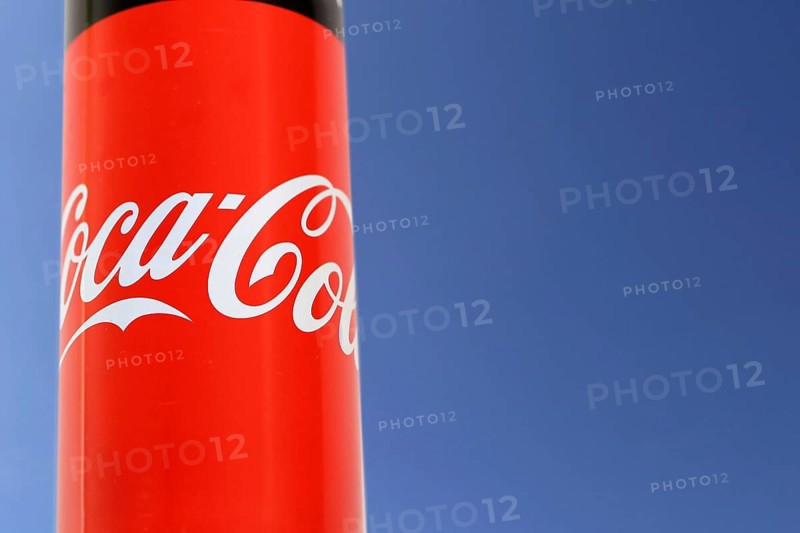 Composing of a can of Coca-Cola and a blue sky as background
