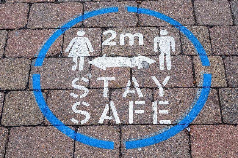 Covid-19 stay 2 metres apart social distancing pavement sign, Newbury, Berkshire, England, UK