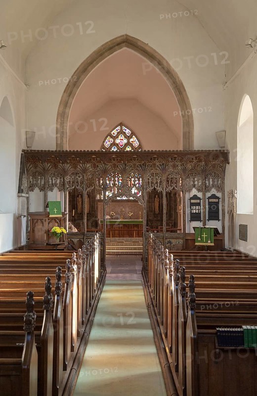 Elaborately decorated wooden rood screen in church of Saint Andrew, Bramfield, Suffolk, England, UK