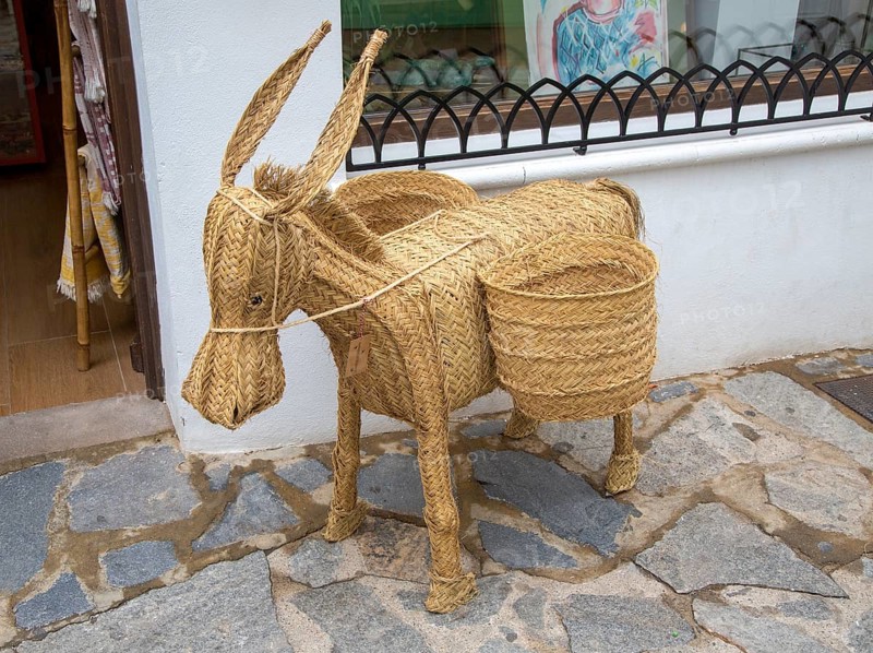 Woven reed mule or donkey product on sale at souvenir shop in village of Mojacar, Almeria, Spain, Europe
