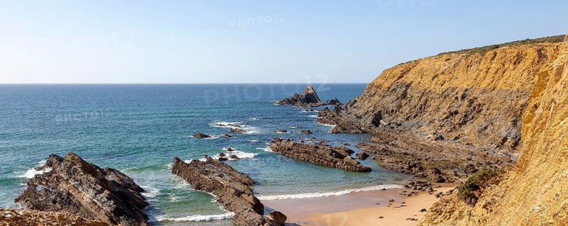 Rocky coastal landscape Praia dos Alteirinhos beach in bay with rocky headland part of Parque Natural do Sudoeste Alentejano e Costa Vicentina, Costa Vicentina and south west Alentejo natural park, Zambujeira do Mar, Alentejo Littoral, Portugal, southern Europe, Europe
