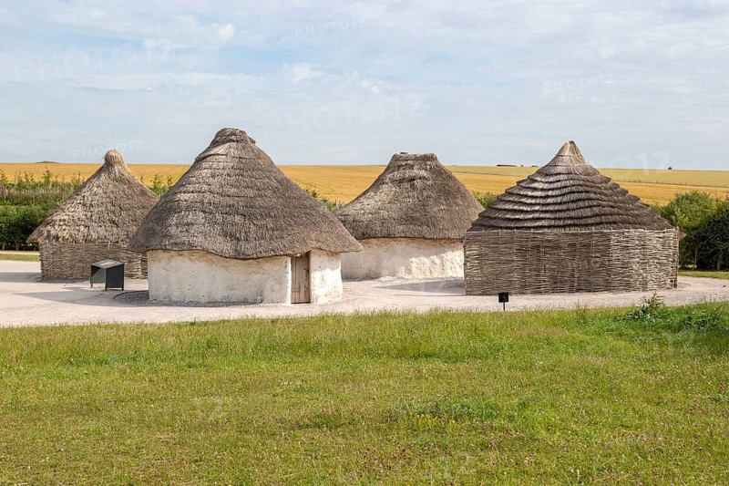 Reconstruction of neolithic homes thatched round houses huts, Stonehenge, Wiltshire, England, UK