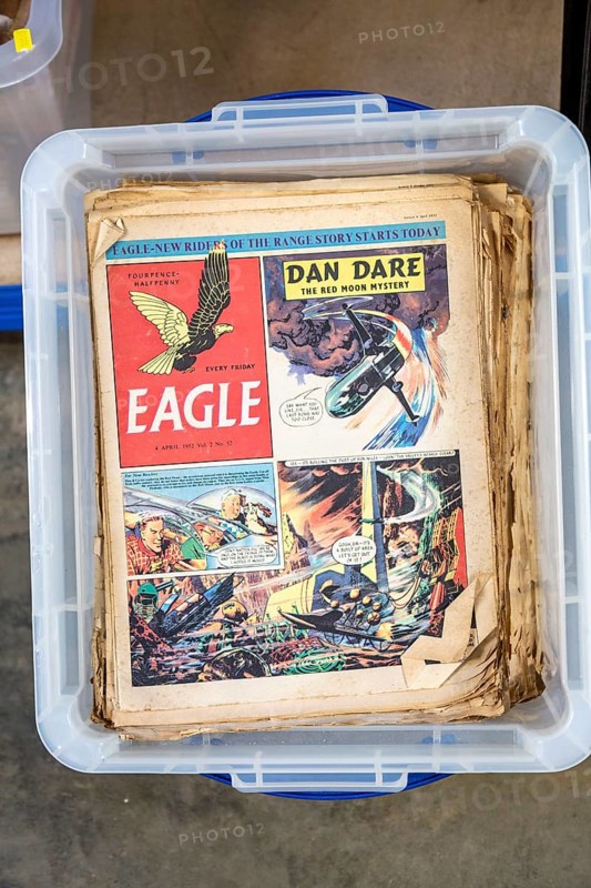 Vintage Eagle comics with Dan Dare cartoon story on display in house clearance auction sale room, UK